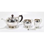 H PIDDUCK & SONS; a George V hallmarked silver three piece tea service of bulbous form, Birmingham