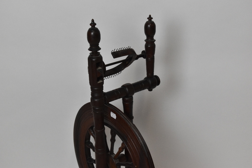 An early 19th century stained pine and oak spinning wheel, height 90cm. - Image 2 of 3
