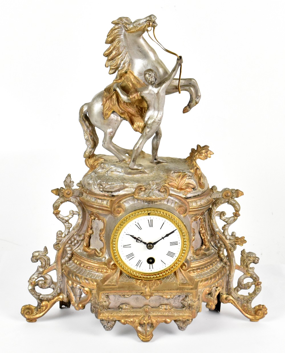 A late 19th century French spelter eight day figural mantel timepiece, modelled with a male figure