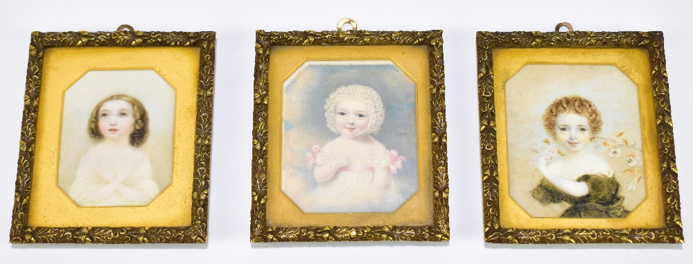 ENGLISH SCHOOL - LATE 19TH CENTURY; set of three watercolour miniatures on ivory, portraits of young