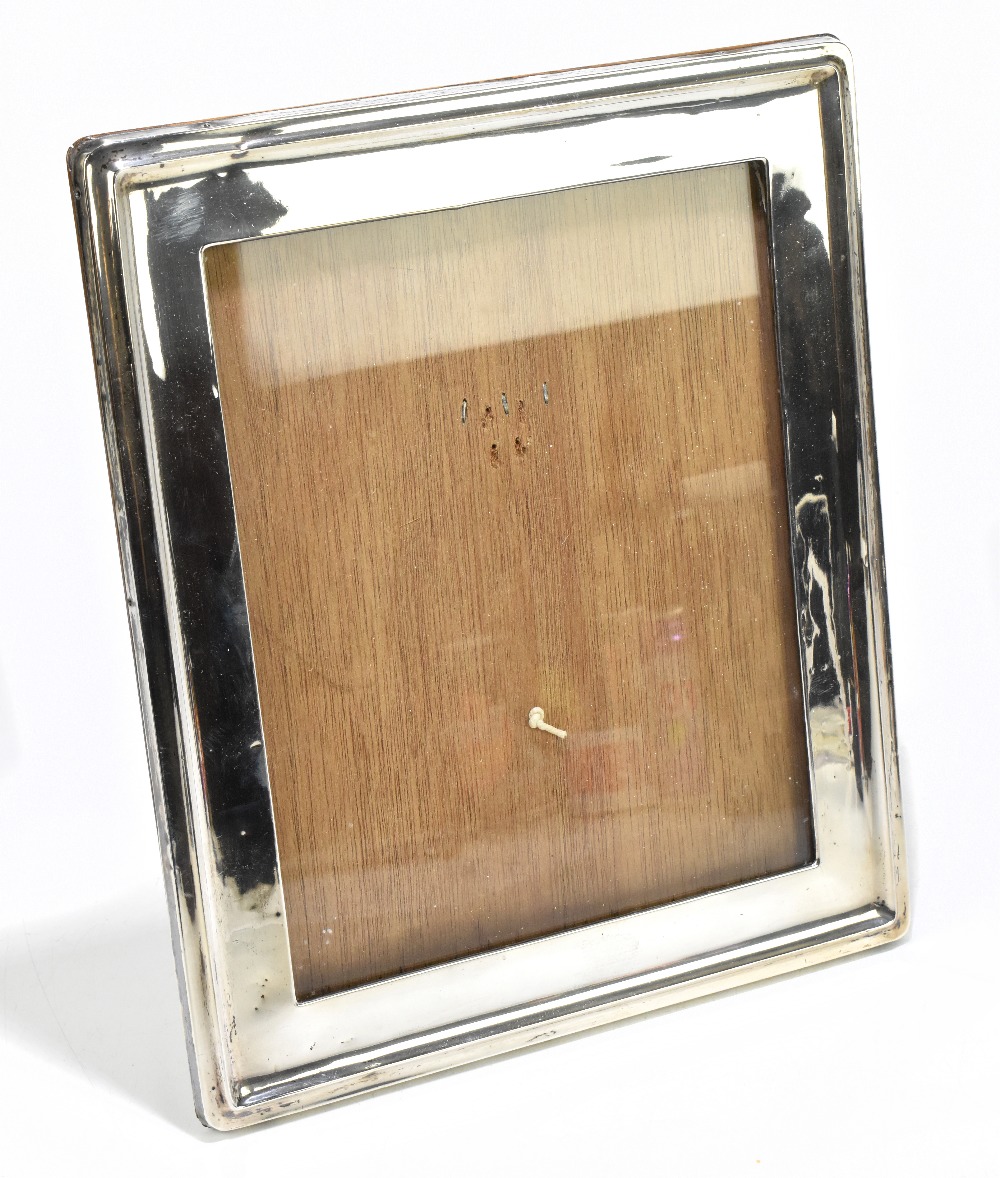 A George V hallmarked silver mounted oak rectangular photograph frame, Birmingham 1918, height 28cm,
