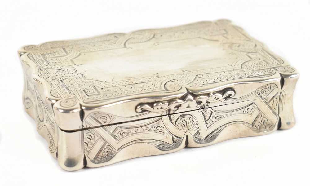 EDWARD SMITH; a large early to mid-Victorian hallmarked silver snuff box of shaped rectangular form,