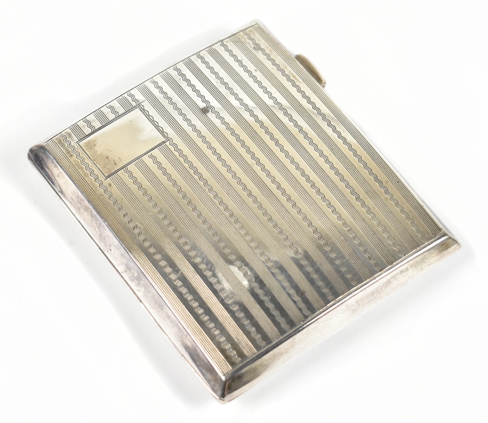 GF WESTWOOD & SONS; a George V hallmarked silver cigarette case of curved rectangular form with