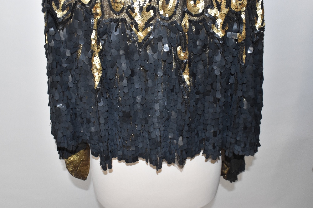 A 1930s gold metallic knit short shoulder cape covered in black lace embellished with large black - Image 4 of 4