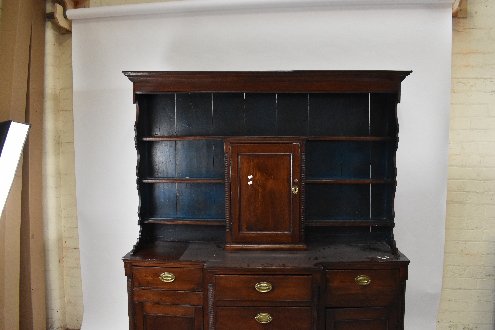 A late 18th/early 19th century oak breakfront dresser, the boarded back with three fixed shelves and - Image 3 of 4