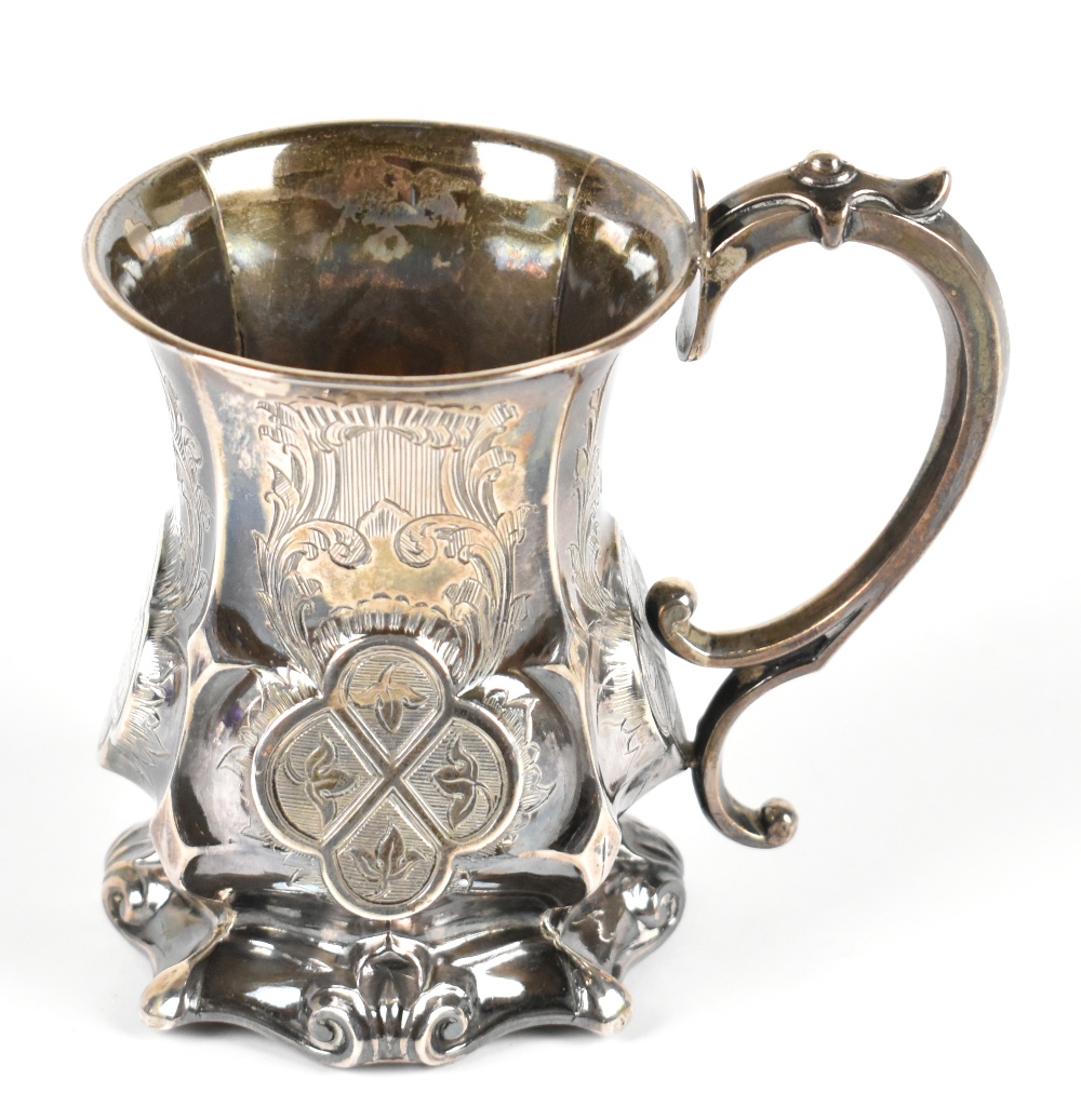 GEORGE UNITE; a Victorian hallmarked silver christening mug with chased scrolling decoration and