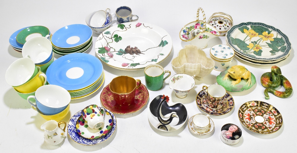 A collection of decorative china, to include four Royal Doulton faience type plates decorated with