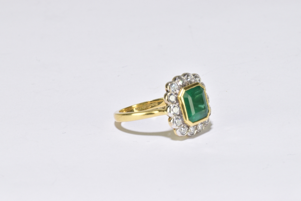 An 18ct yellow gold emerald and diamond ring, the central square cut emerald measuring approx 8mm in - Image 3 of 3