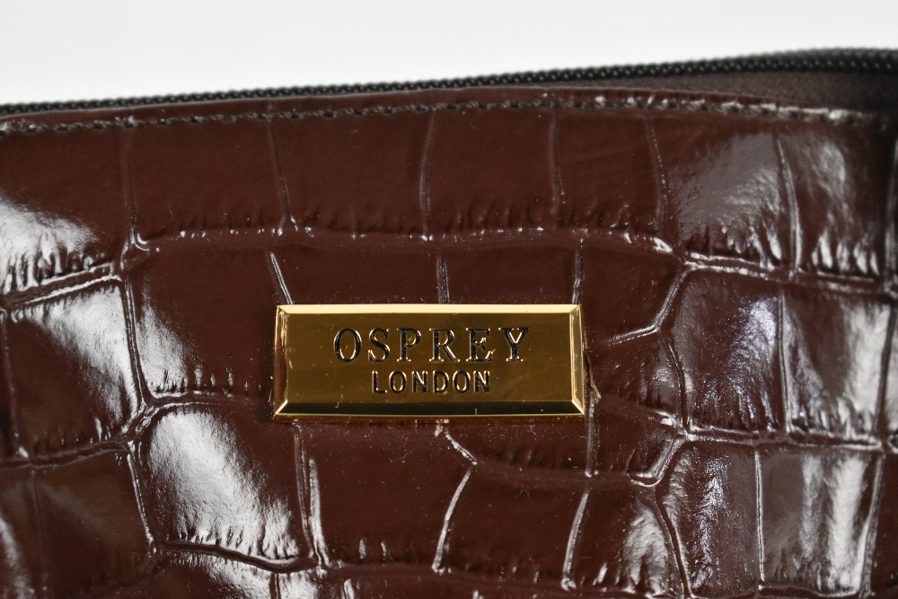 OSPREY; an unused brown crocodile embossed leather handbag with two top handles, gold tone maker's - Image 3 of 4