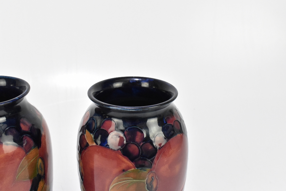 WALTER MOORCROFT; a pair of cylindrical vases with flared necks decorated in the 'Pomegranate' - Image 3 of 6