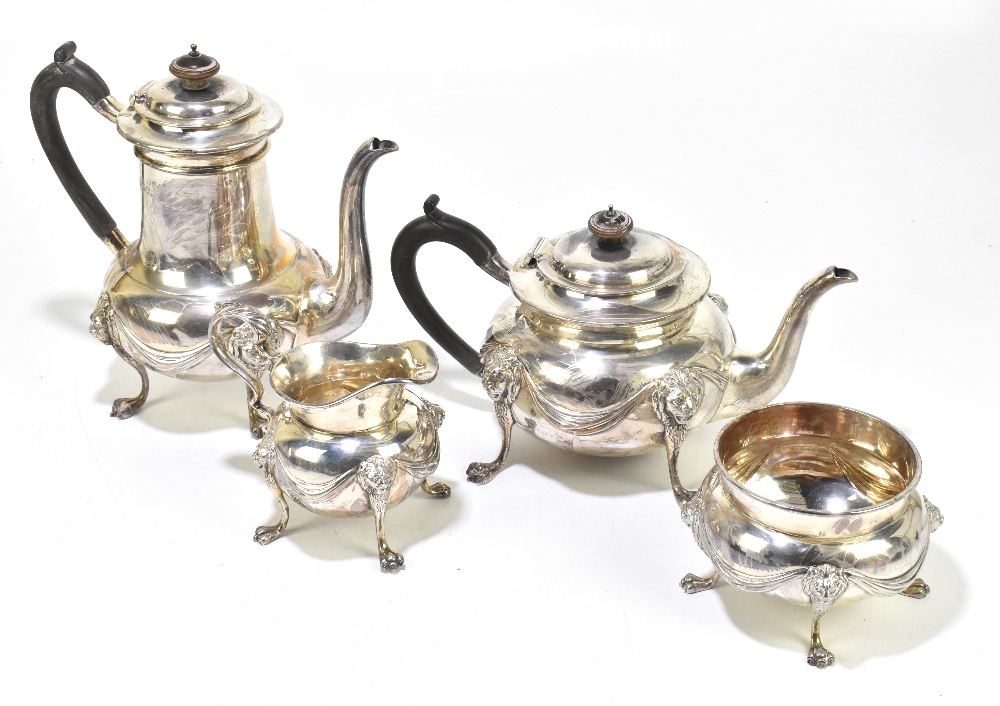 CARRINGTON & CO; a Victorian hallmarked silver four piece tea service with cast ribbons, lion mask