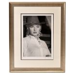 AFTER EVE ARNOLD; a reproduced black and white coloured print, 'Marilyn Monroe', with facsimile
