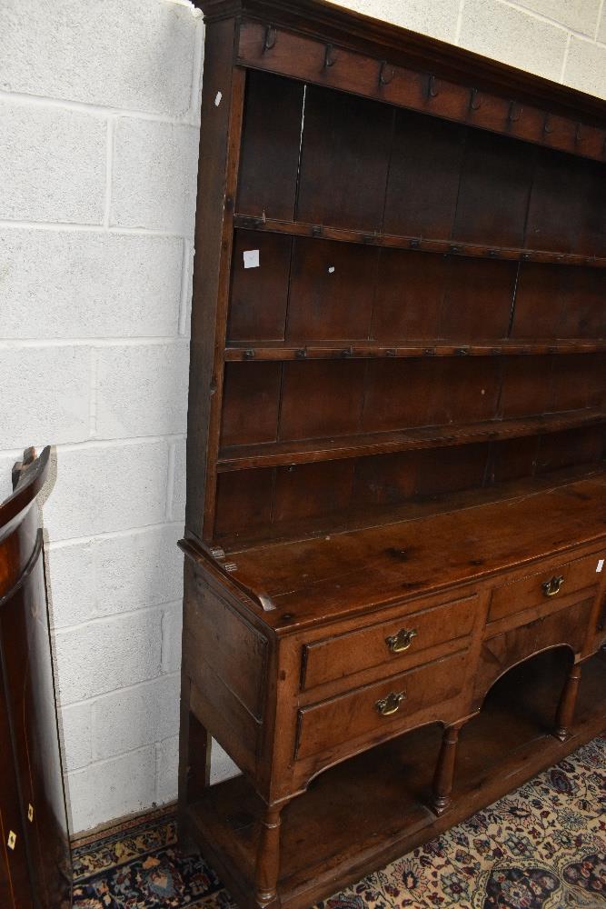 An 18th century oak dresser with boarded plate rack back with five drawers raised on block feet, - Image 3 of 4