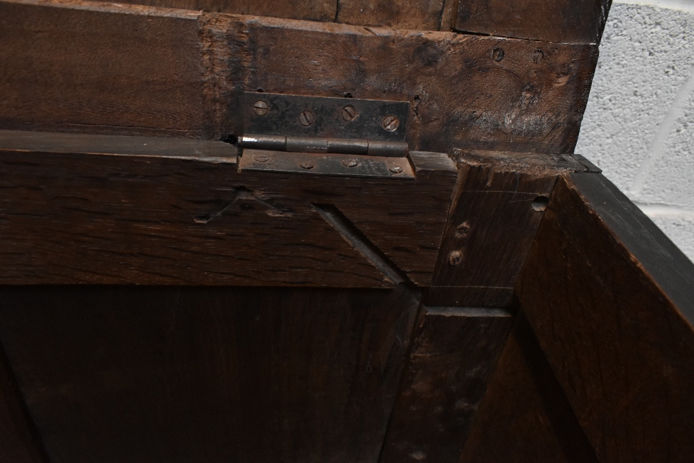 A late 17th century carved oak coffer, on stile feet, height 64cm, width 127cm, depth 51cm. - Image 4 of 4
