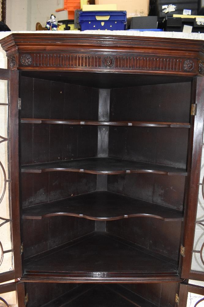 A George III mahogany freestanding corner cabinet, with moulded cornice above two pairs of - Image 6 of 6