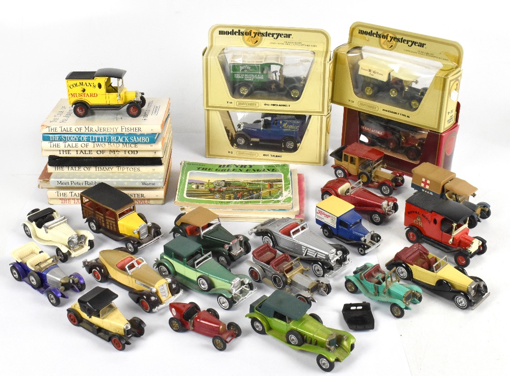 A small collection of diecast vehicles, including Matchbox, with a miscellany of children's books,