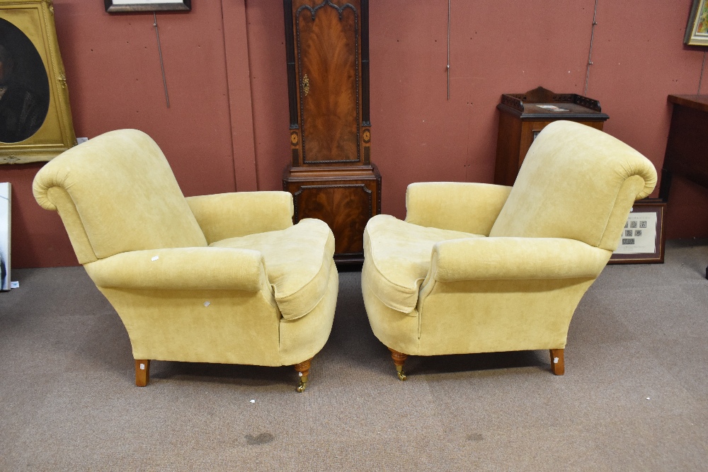 A pair of good quality yellow upholstered armchairs on turned supports with brass castors. - Image 3 of 4