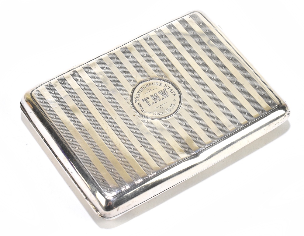 ROBERT CHANDLER; an George V hallmarked silver cigarette case of rectangular form with engine turned
