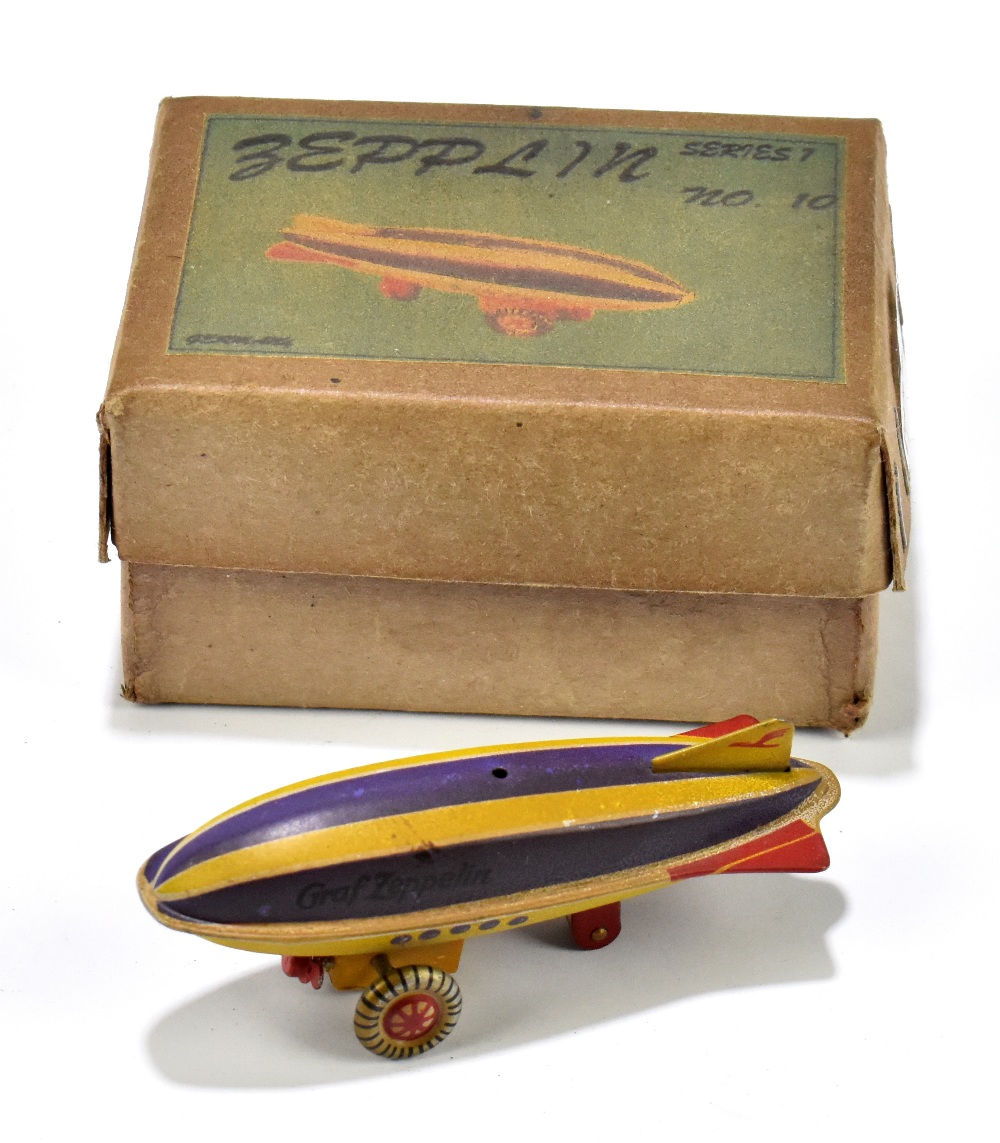 A German miniature wind up zeppelin, in original box.