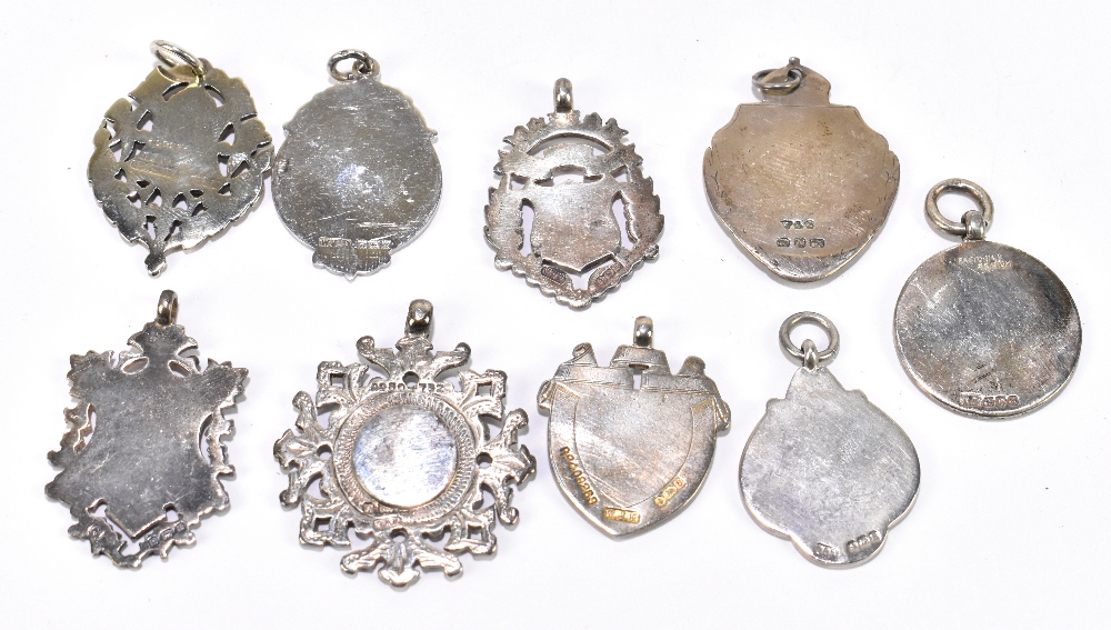 Nine various hallmarked silver fob medallions with vacant panels, one with enamelled detail, all - Image 2 of 2