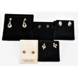 Four pairs of 9ct yellow gold ear studs and a pair of drop earrings.