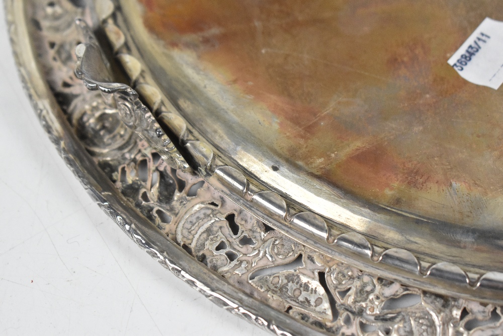 A 19th century white metal circular salver with engraved centre and pierced border, decorated with - Image 5 of 5