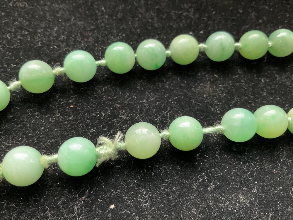 A 1920s/30s jade bead necklace, re-strung and with modern ring loop fastener, length 46cm, each bead - Image 8 of 8