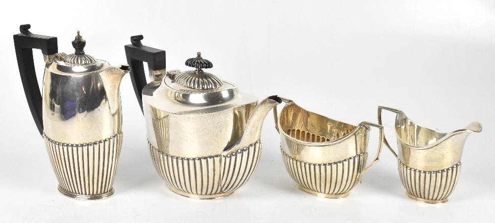 ROBERT PRINGLE & SON; a George V hallmarked silver four piece tea service, comprising teapot, hot