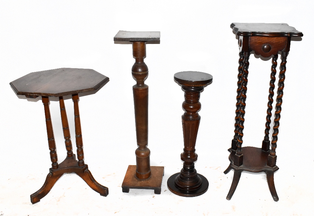An early 20th century oak two tier jardinière stand with barley twist supports, two further