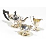THOMAS BRADBURY & SONS; a Victorian hallmarked silver three piece tea service of oval form with