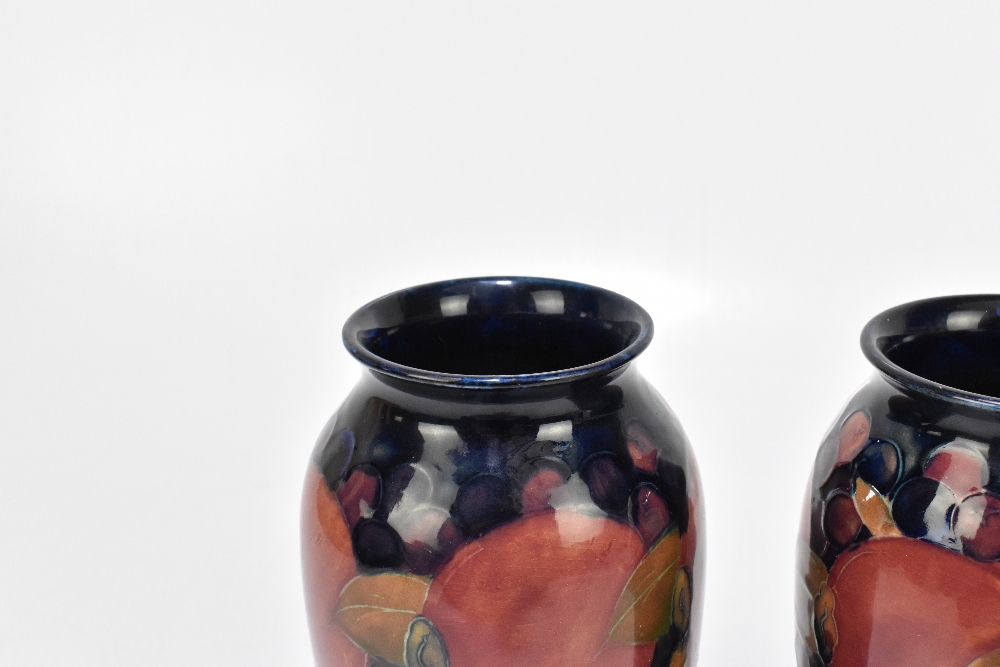 WALTER MOORCROFT; a pair of cylindrical vases with flared necks decorated in the 'Pomegranate' - Image 2 of 6