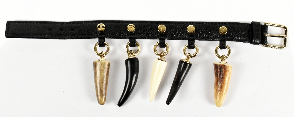 YVES SAINT LAURENT RIVE GAUCHE; a vintage black leather bracelet with five tooth charms with gold