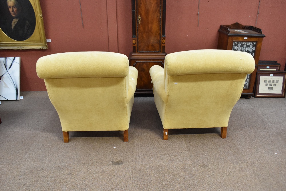 A pair of good quality yellow upholstered armchairs on turned supports with brass castors. - Image 4 of 4