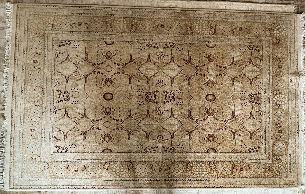 A large Pakistani woollen cream ground carpet, 284 x 182cm.