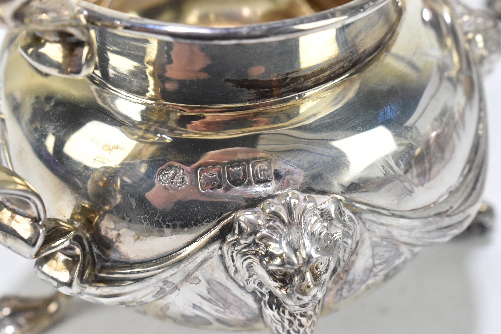 CARRINGTON & CO; a Victorian hallmarked silver four piece tea service with cast ribbons, lion mask - Image 3 of 5