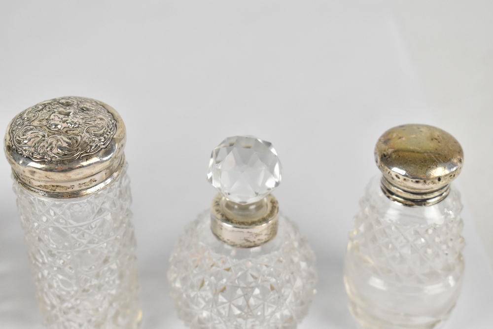 Six cut glass dressing table and perfume bottles, each with hallmarked silver collars or rims, - Image 3 of 3