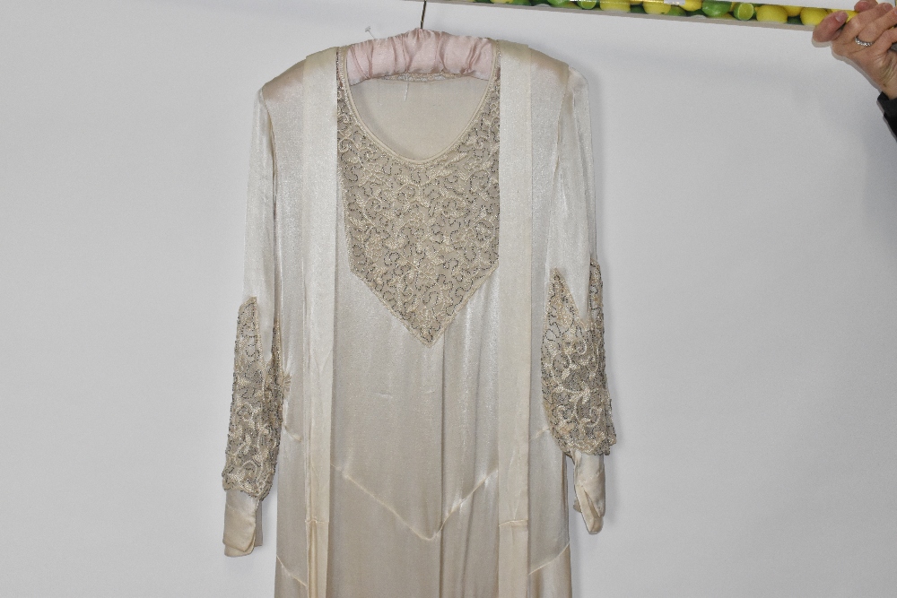 A 1920s handmade cream silk and lace beaded wedding dress decorated with sequins and beads, - Image 3 of 4