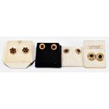 Four pairs of 9ct yellow gold and garnet ear studs.