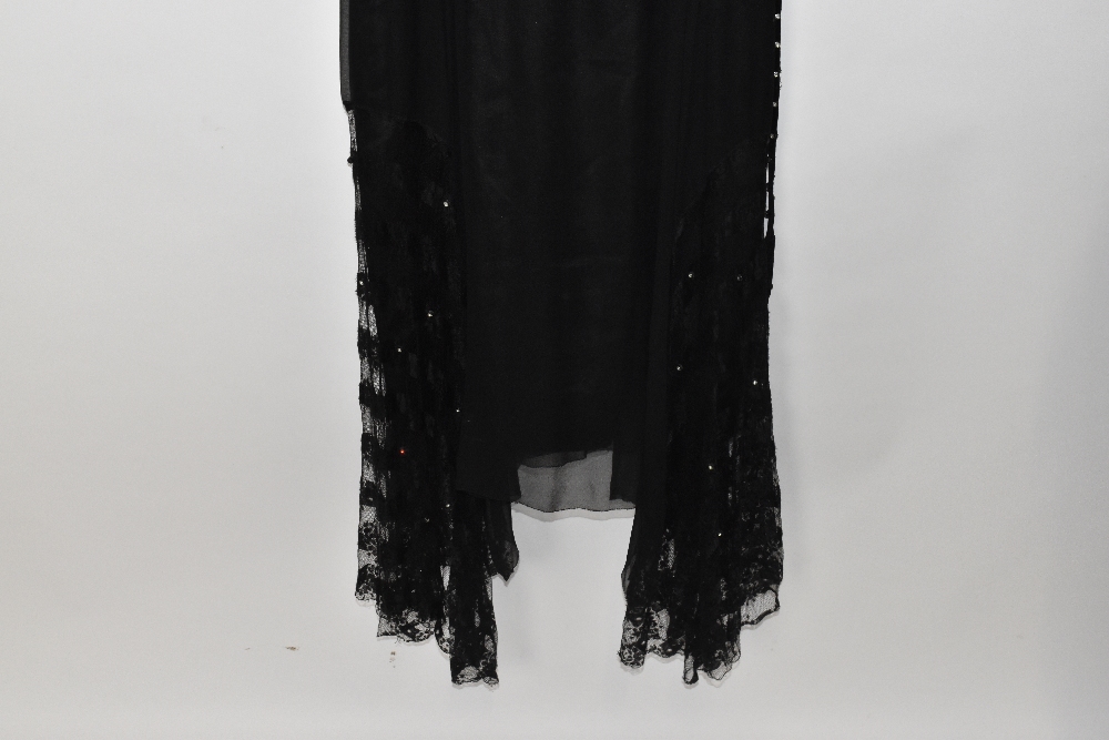 A 1920s black silk and handmade lace evening dress lined with silk with a swag hem embellished - Image 3 of 4