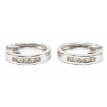 A pair of modern 18ct white gold and diamond set hoop earrings, each with princess cut channel set