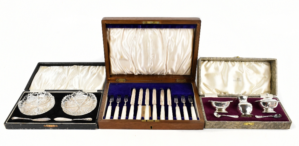 JOHN ROUND; a cased set of six pairs of George V silver and mother of pearl fruit knives and