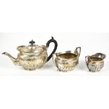 DANIEL & JOHN WELBY; a late Victorian hallmarked silver three piece part gadrooned tea set, length