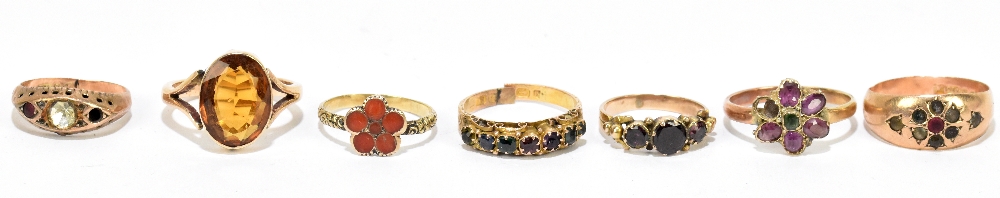Three 9ct yellow gold dress rings, combined 6.45g, a 15ct yellow gold gem set ring, 1.8g, and