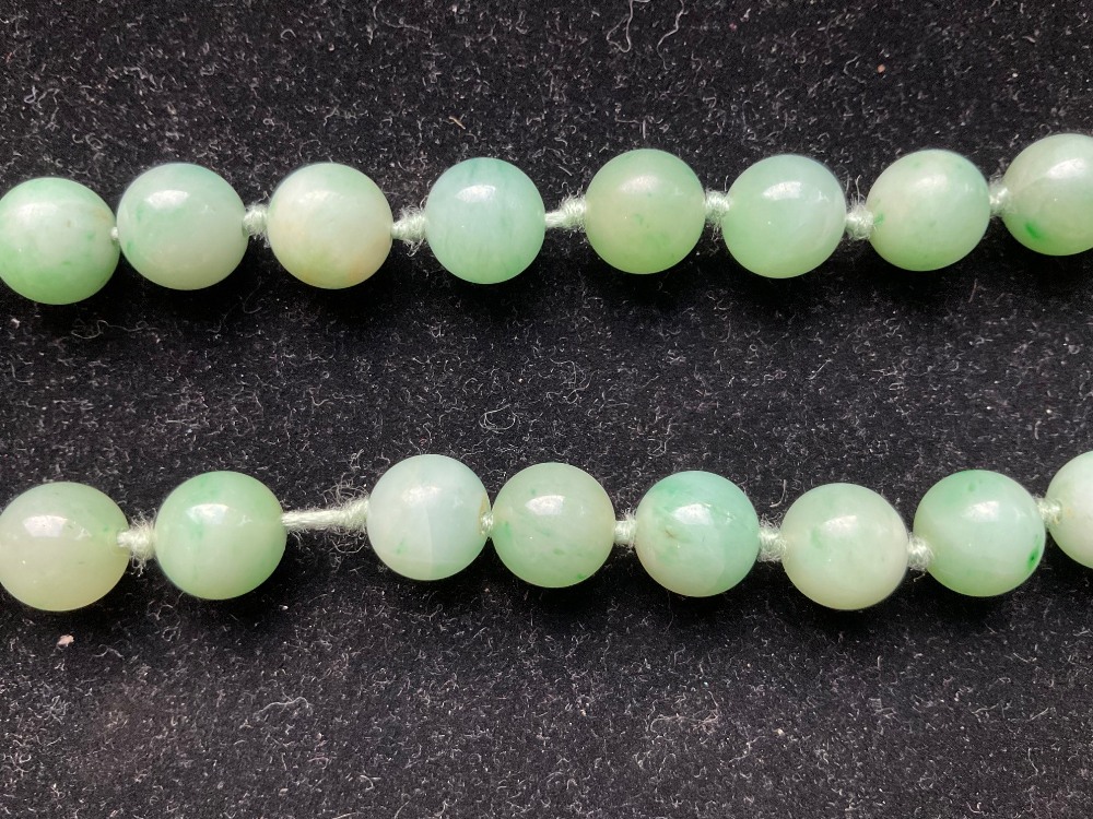 A 1920s/30s jade bead necklace, re-strung and with modern ring loop fastener, length 46cm, each bead - Image 4 of 8