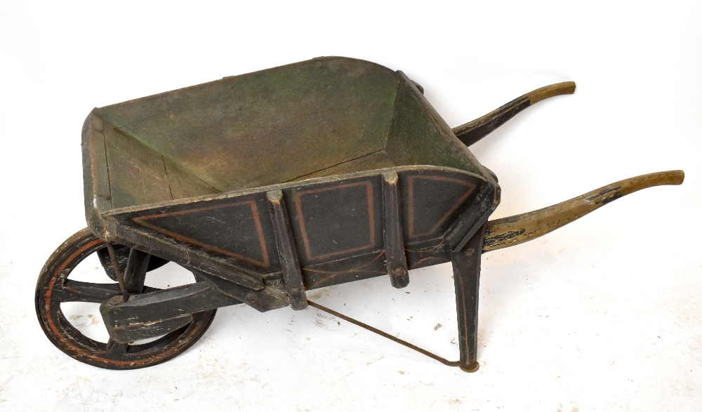 A vintage painted wooden wheelbarrow, overall length approx 115cm.