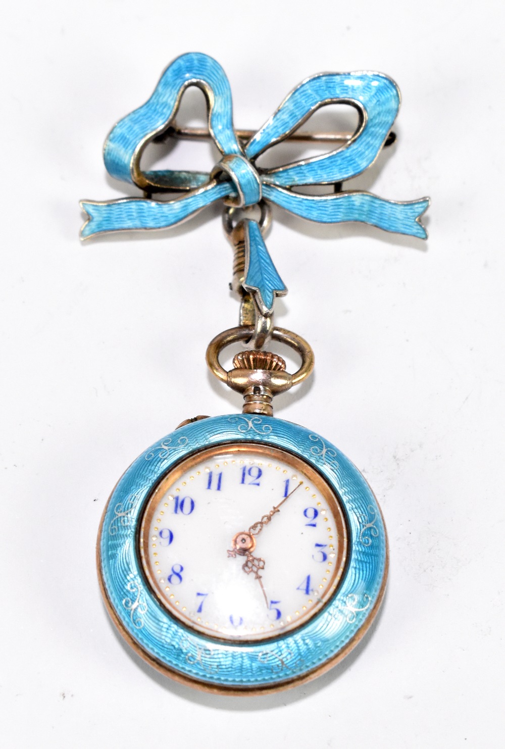 An early 20th century silver gilt, silver and enamel decorated fob watch, with ribbon bow attachment