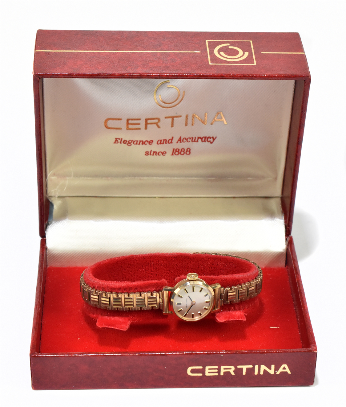 CERTINA; a lady's vintage 9ct yellow gold wristwatch with baton markers to the circular dial and