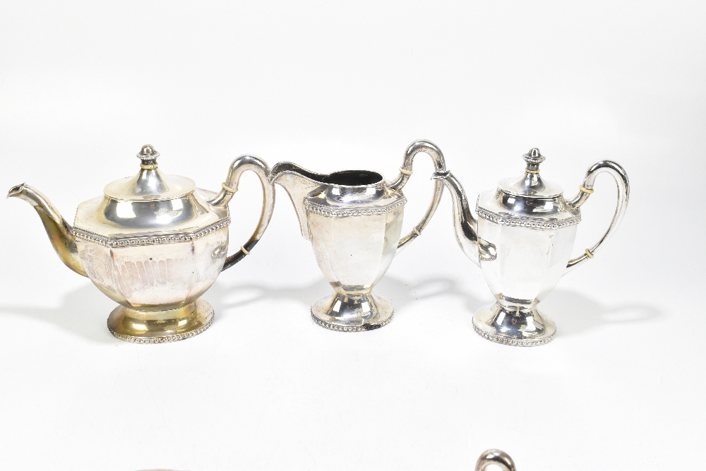 An unmarked white metal five piece tea service with panelled bodies and cast rims, with ivory - Image 2 of 3