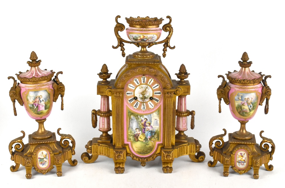 A 19th century French three piece gilt metal clock garniture, with pink and hand painted porcelain