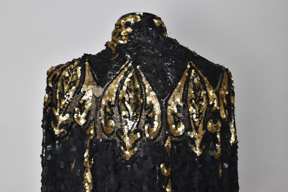 A 1930s gold metallic knit short shoulder cape covered in black lace embellished with large black - Image 3 of 4